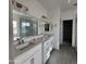 Double vanity bathroom with modern finishes and large mirror at 22254 W Skinner Rd, Wittmann, AZ 85361