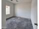Bright bedroom with large window and ceiling fan at 22254 W Skinner Rd, Wittmann, AZ 85361