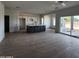 Open kitchen with island, modern appliances, and tile flooring at 22254 W Skinner Rd, Wittmann, AZ 85361