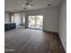 Bright living room featuring tile floors and access to backyard at 22254 W Skinner Rd, Wittmann, AZ 85361