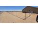 Wide-angle view of the spacious backyard, showcasing full fencing at 22270 W Skinner Rd, Wittmann, AZ 85361