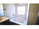 Bathroom features a soaking tub with chrome fixtures and a nice sized window at 22270 W Skinner Rd, Wittmann, AZ 85361