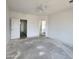 Spacious bedroom with ceiling fan and access to bathroom at 22270 W Skinner Rd, Wittmann, AZ 85361