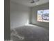 Spacious bedroom with large window and view of neighborhood at 22270 W Skinner Rd, Wittmann, AZ 85361