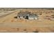 New construction home showing roof tiles being installed, and a two car garage at 22270 W Skinner Rd, Wittmann, AZ 85361