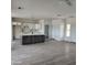 Modern kitchen with island, white cabinets, and dark countertops at 22270 W Skinner Rd, Wittmann, AZ 85361