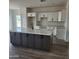 Open kitchen featuring a large island and modern cabinetry at 22270 W Skinner Rd, Wittmann, AZ 85361