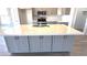 Spacious kitchen island with quartz countertops and modern cabinetry at 22270 W Skinner Rd, Wittmann, AZ 85361