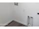 Simple laundry room with hookups and storage at 22270 W Skinner Rd, Wittmann, AZ 85361