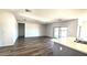 Bright living room featuring wood floors and sliding glass doors at 22270 W Skinner Rd, Wittmann, AZ 85361