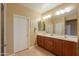 Double vanity bathroom with a large mirror at 2471 E Katrina Trl, Casa Grande, AZ 85194