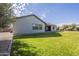 Large backyard with green lawn and a view of the house at 2480 E Haymore St, Gilbert, AZ 85298