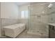 Relaxing bathroom with soaking tub, walk-in shower, and modern vanity at 2480 E Haymore St, Gilbert, AZ 85298