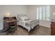 Bright bedroom with wood floors and a metal bed frame at 2480 E Haymore St, Gilbert, AZ 85298