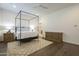 Main bedroom with ensuite access and hardwood floors at 2480 E Haymore St, Gilbert, AZ 85298