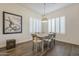Charming dining area with rustic wooden table and four chairs at 2480 E Haymore St, Gilbert, AZ 85298