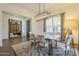 Spacious dining room with marble table, chandelier and entryway view at 2480 E Haymore St, Gilbert, AZ 85298