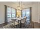 Elegant dining room features a marble table, chandelier, and access to backyard at 2480 E Haymore St, Gilbert, AZ 85298