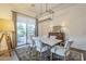 Elegant dining room with marble table, chandelier, and view to backyard at 2480 E Haymore St, Gilbert, AZ 85298