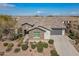 Single-story home with stone accents and landscaped yard at 2480 E Haymore St, Gilbert, AZ 85298