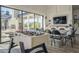 Game room with foosball table, seating area, and view of outdoor space at 2480 E Haymore St, Gilbert, AZ 85298