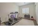 Home gym includes treadmill, exercise bike and weights at 2480 E Haymore St, Gilbert, AZ 85298