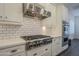 Modern kitchen with stainless steel appliances and white shaker cabinets at 2480 E Haymore St, Gilbert, AZ 85298