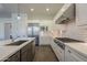 Modern kitchen with stainless steel appliances and white shaker cabinets at 2480 E Haymore St, Gilbert, AZ 85298