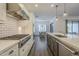 Modern kitchen with white cabinets, stainless steel appliances, and subway tile backsplash at 2480 E Haymore St, Gilbert, AZ 85298