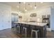 Modern kitchen with a large island, stainless steel appliances, and white cabinetry at 2480 E Haymore St, Gilbert, AZ 85298