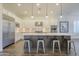 Modern kitchen with a large island, stainless steel appliances, and white cabinetry at 2480 E Haymore St, Gilbert, AZ 85298