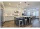 Modern kitchen with a large island, stainless steel appliances, and white cabinetry at 2480 E Haymore St, Gilbert, AZ 85298