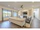 Relaxing living room with large windows and a cozy seating area at 2480 E Haymore St, Gilbert, AZ 85298