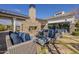 Outdoor fireplace and seating area with stylish furniture at 2480 E Haymore St, Gilbert, AZ 85298