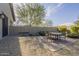 Relaxing patio with round table and chairs, perfect for outdoor dining at 2480 E Haymore St, Gilbert, AZ 85298