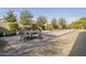 Outdoor patio area with a table and chairs next to a bocce ball court at 2480 E Haymore St, Gilbert, AZ 85298