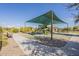 Community playground with shaded play structures and ample space at 2480 E Haymore St, Gilbert, AZ 85298