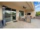 Covered patio with seating area and outdoor TV at 27211 W Yukon Cir, Buckeye, AZ 85396