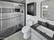 Modern bathroom with a walk-in shower, dark gray vanity, and white toilet at 3005 S Pennington --, Mesa, AZ 85202