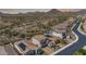 Desert homes feature tile roofs and solar panels, backing up to the natural desert landscape and gorgeous mountain views at 30704 N 138Th Ave, Peoria, AZ 85383