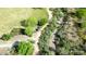 An aerial view showcases a meandering walking path through the verdant grounds of the Vistancia community at 30704 N 138Th Ave, Peoria, AZ 85383