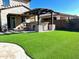 Artificial turf lawn with pergola and outdoor kitchen at 30704 N 138Th Ave, Peoria, AZ 85383