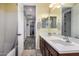 Double vanity bathroom featuring dual sinks, tile floors, and modern fixtures at 30704 N 138Th Ave, Peoria, AZ 85383