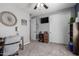 Cozy bedroom featuring a ceiling fan, carpeted floors and an entertainment center with ample storage space at 30704 N 138Th Ave, Peoria, AZ 85383