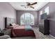 Charming bedroom with large windows, offering natural light and a relaxing atmosphere for a comfortable rest at 30704 N 138Th Ave, Peoria, AZ 85383