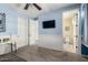 Bedroom featuring a ceiling fan, a closet, and a bathroom at 30704 N 138Th Ave, Peoria, AZ 85383