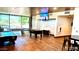 Community game room features a pool table, ping pong table, foosball, and TV at 30704 N 138Th Ave, Peoria, AZ 85383