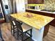 Kitchen island with granite countertop and seating for two at 30704 N 138Th Ave, Peoria, AZ 85383