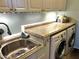 Clean laundry room with a new sink and under-cabinet lighting at 30704 N 138Th Ave, Peoria, AZ 85383