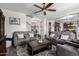 Cozy living room featuring plush seating, decorative lighting, and an open layout at 30704 N 138Th Ave, Peoria, AZ 85383